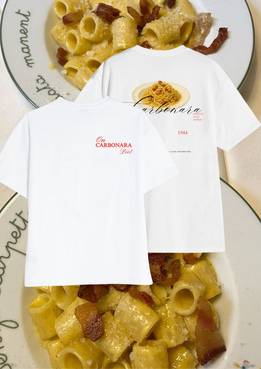 White t-shirt with carbonara design on a plate of pasta